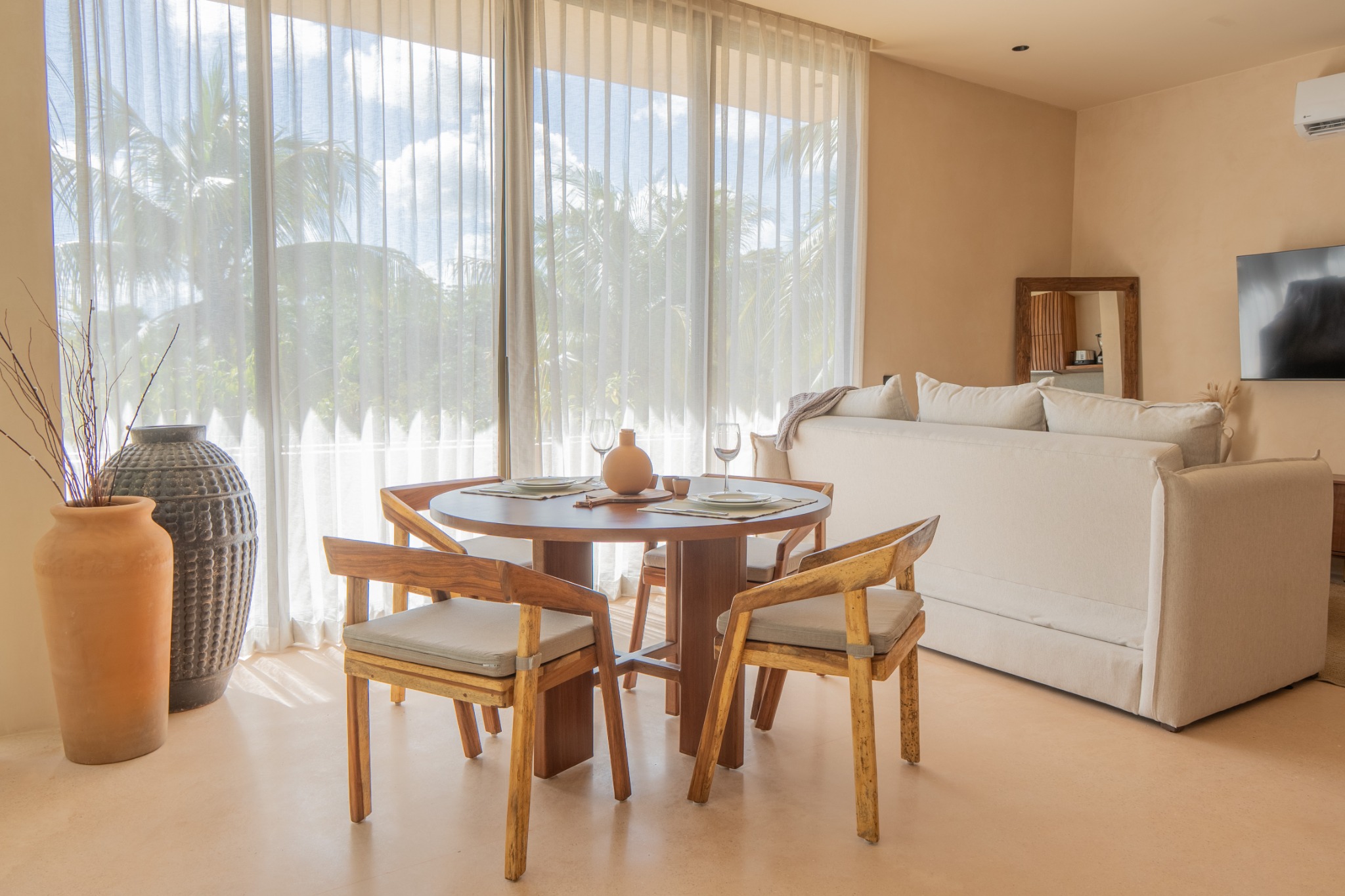 Light filled dining and living area with tropical views